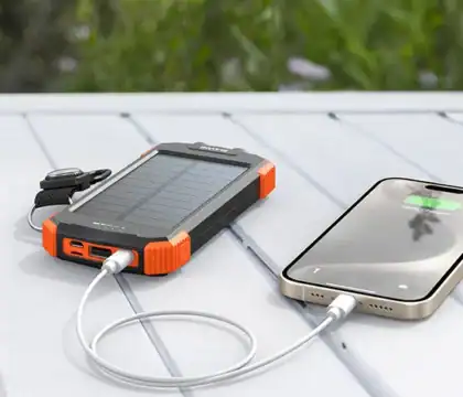 Compact solar charger providing renewable power for phones, cameras, or GPS devices while off the grid.